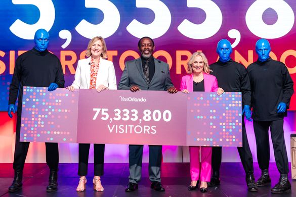 Visit Orlando Board Chair Barb Bowden, Visit Orlando President & CEO Casandra Matej, Orange County Mayor Jerry Demings and the Blue Man Group, who performed during Visit Orlando's Signature Luncheon during National Travel & Tourism Week. Visit Orlando Board Chair Barb Bowden, Visit Orlando President & CEO Casandra Matej, Orange County Mayor Jerry Demings and the Blue Man Group, who performed during Visit Orlando's Signature Luncheon during National Travel & Tourism Week.